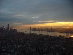 Manhattan city houses on the shore during sunset