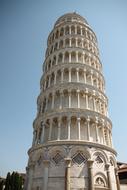 Beautiful Pisa Tower with the columns in Pisa, Italy, under the blue sky