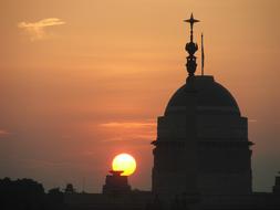 Silhouette of the Rashtrapathi Bhavan in New Delhi, India, at colorful and beautiful sunset