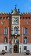 Beautiful City hall with the clock in Odense, Denmark, under the blue sky