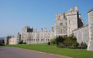 Beautiful Windsor Castle in United Kingdom, among the green plants, under the blue sky