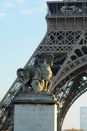 horsy, aged stone sculpture in front of Eiffel Tower, France, paris