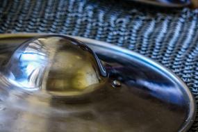 Close-up of the shiny, metal armour shield on the chain mail