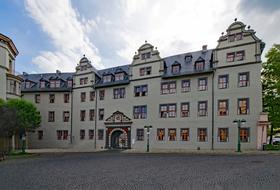 Beautiful building in Weimar, Thuringia, Germany, among the green trees