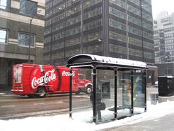 Snowy Bus Stop in city