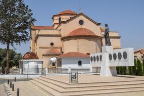 Beautiful and colorful church with the monument in Avgorou, Cyprus, Greece