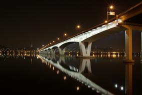 Bridge in Seoul, with lights and reflection in the water, in South Korea, at the night