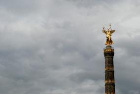 golden sculpture on a tower in Berlin, Germany