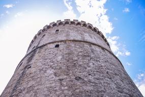 tower under blue sky with clouds in greece