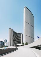 Buildings in the city, with the windows, in sunlight, under the blue sky