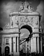 Black and white photo of the beautiful architecture with patterns, in Lisbon, Portugal, under the clouds