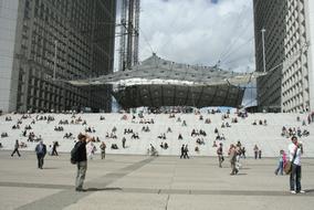 tourists and the Grande Arche in Paris