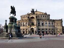 People near the beautiful monument and Semper Opera House in Dresden, Germany