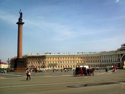 People, among the beautiful and colorful buildings in Saint Petersburg in Russia, under the blue sky with white clouds