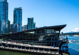 Beautiful port with the buildings in Vancouver, Canada, under the blue sky with white clouds