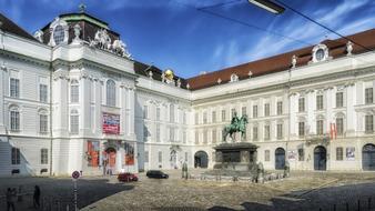 statue of a horseman in front of a building in vienna