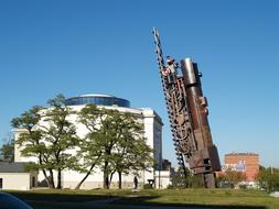 monument to the locomotive against the blue sky in the city