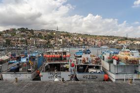 boats in the port of sicily on a cloudy day