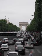 Landscape of Champs ElysÃ©es with vehicles, near the Arc De Triomphe, in Paris, France