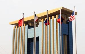 Colorful building and colorful flags in sunlight