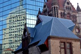 historic building against the backdrop of a modern skyscraper in Boston