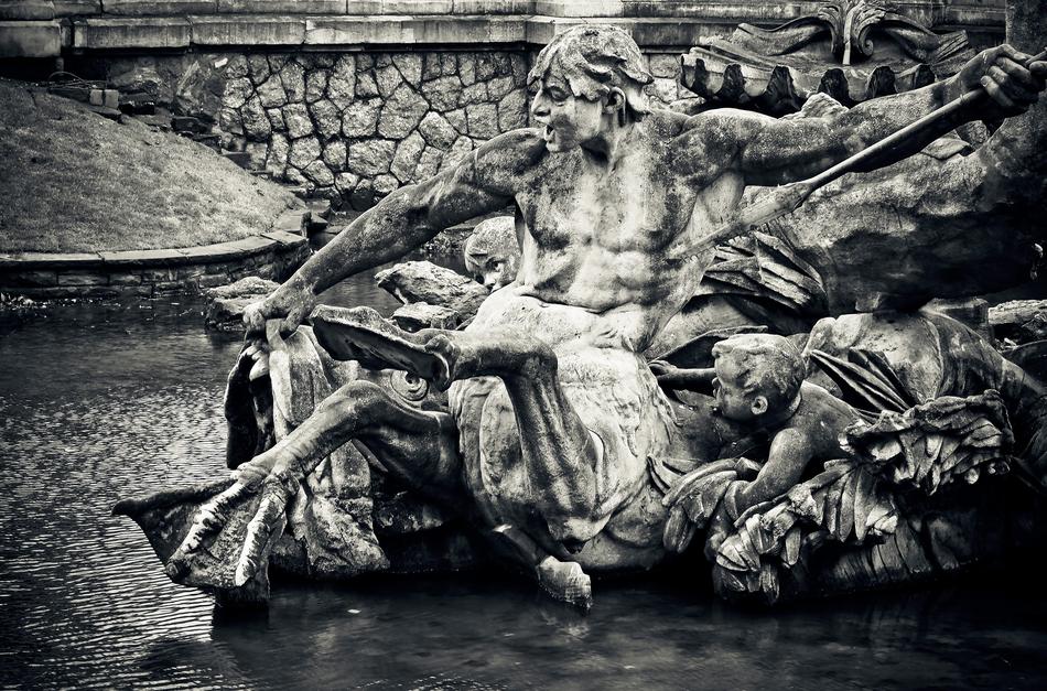 Black and white photo, with the close-up of the beautiful statue, with the fountain, in DÃ¼sseldorf, Germany