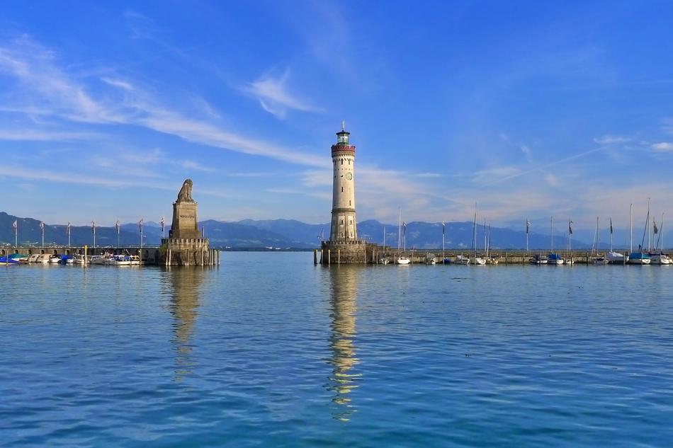 Beautiful landscape of Lindau, with the water harbor, with the mountains on background, in Germany