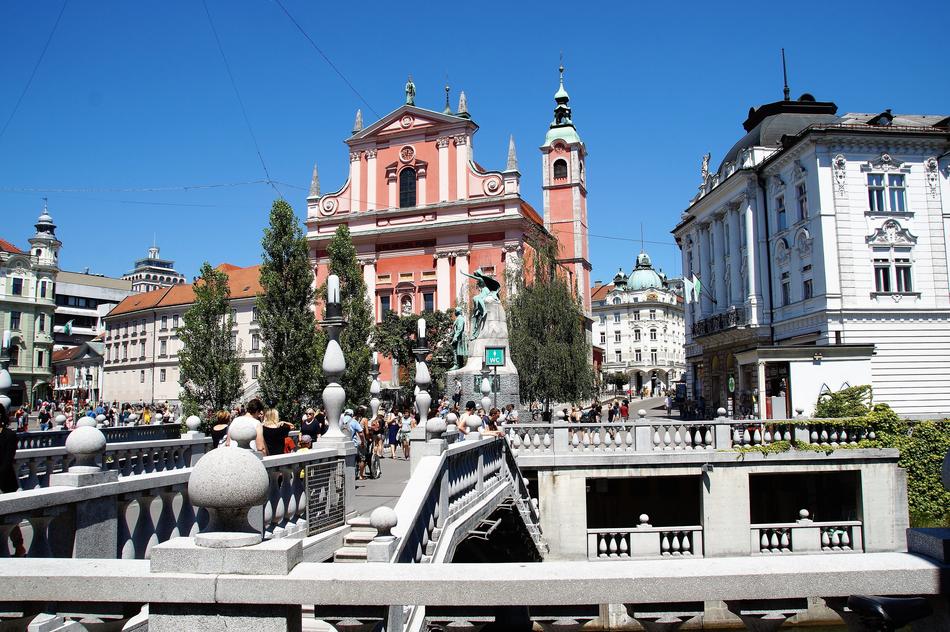 People in the beautiful and colorful old town of Ljubjana in Slovenia