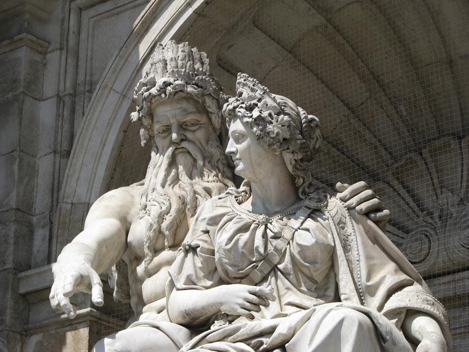 Beautiful, white statue of the couple in light, in Vienna, Austria