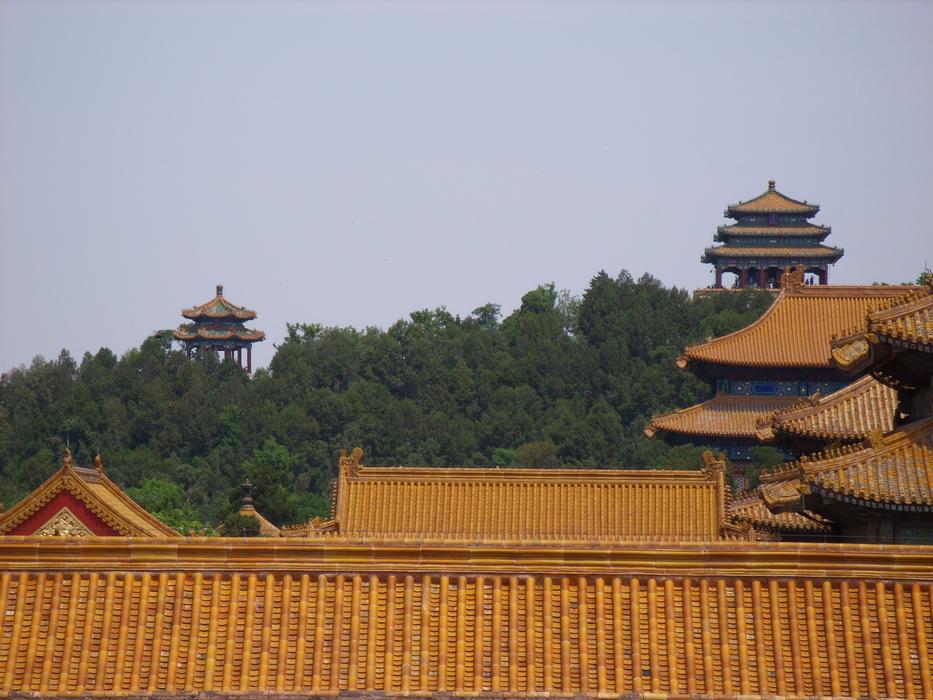 Beautiful and colorful buildings on the Great Wall in China, among the green trees