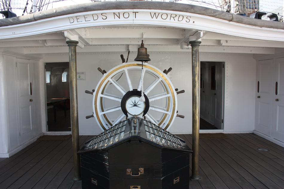 Beautiful, white steering wheel on the wheelhouse, with the sign