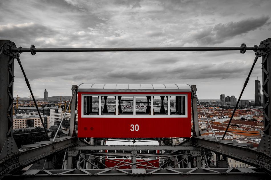 Red and white landmark, among the beautiful Vienna, under the cloudy sky, in Austria