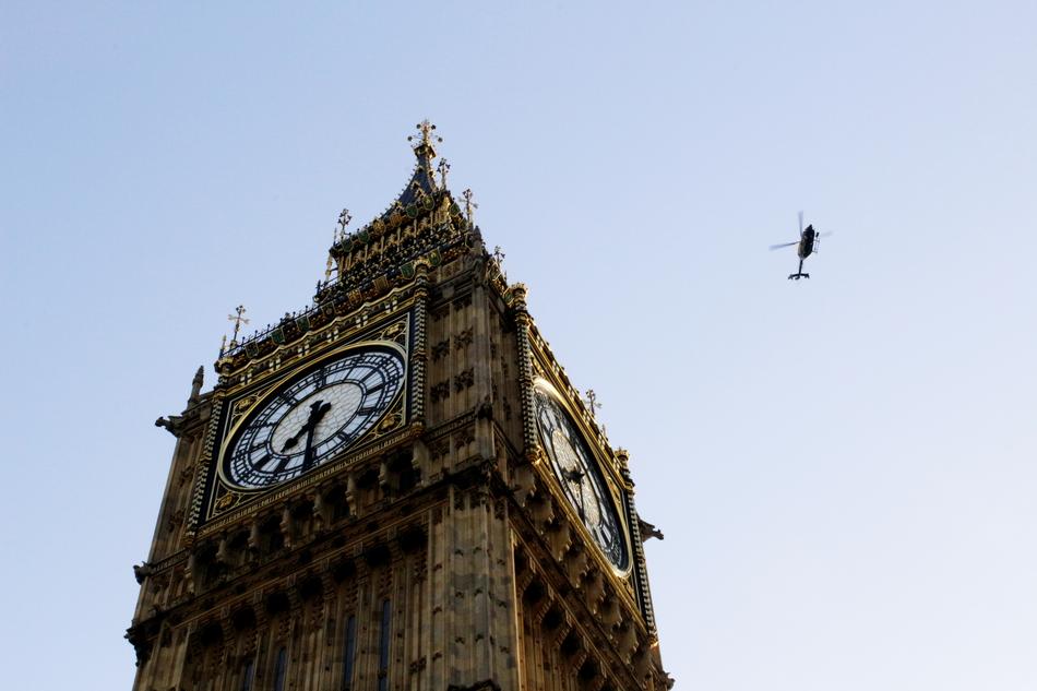 Big Ben tower and helicopter in the sky over London