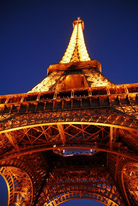 golden eiffel tower on the background of the night sky in paris