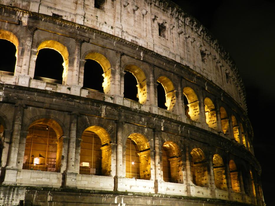 lights in the windows in the colosseum at night