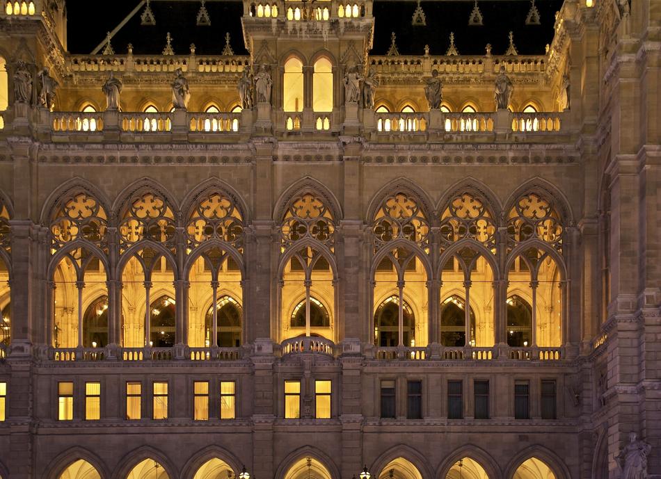 city hall with light in the windows in vienna at night