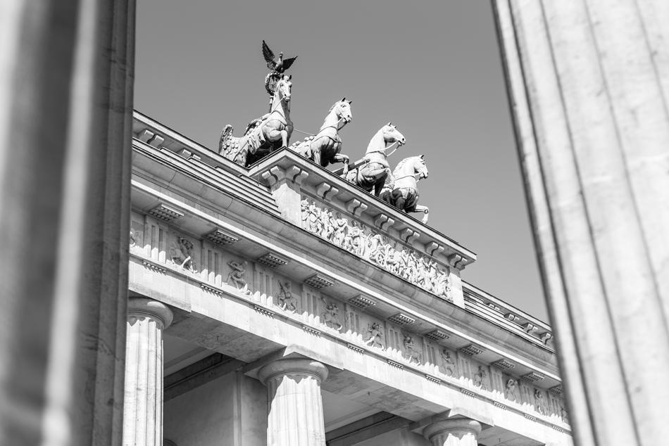 Black and white photo of beautiful Brandenburg Gate with Quadriga in Berlin, Germany