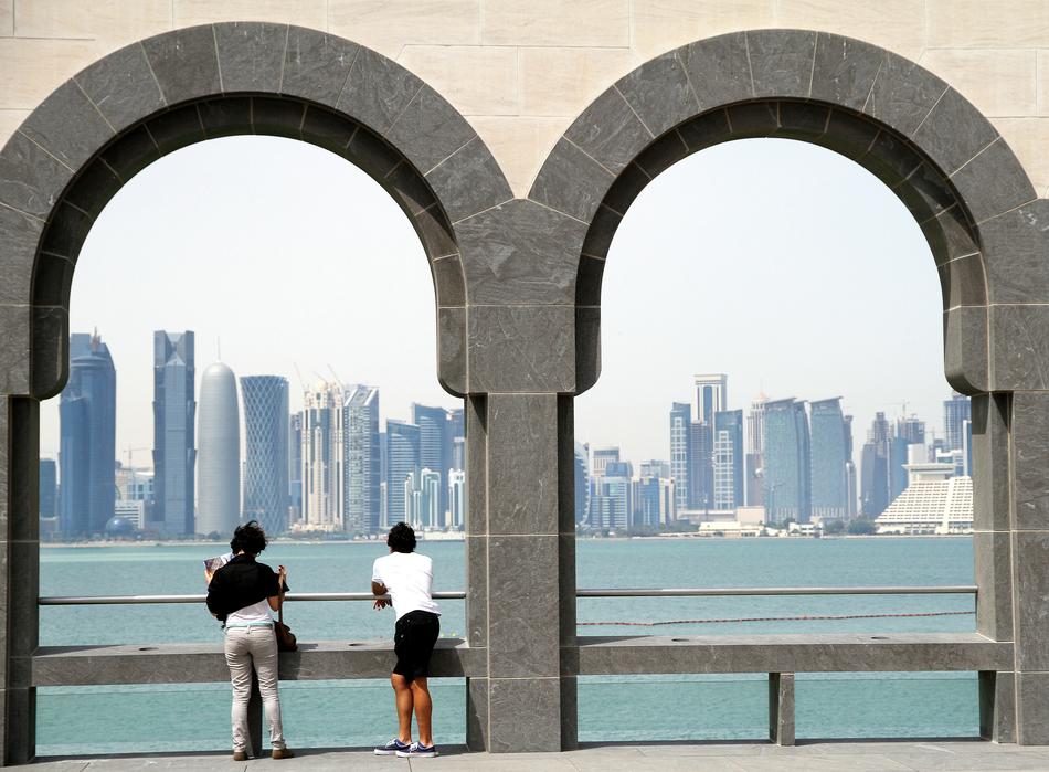 People in the beautiful museum on the coast in Doha, Qatar