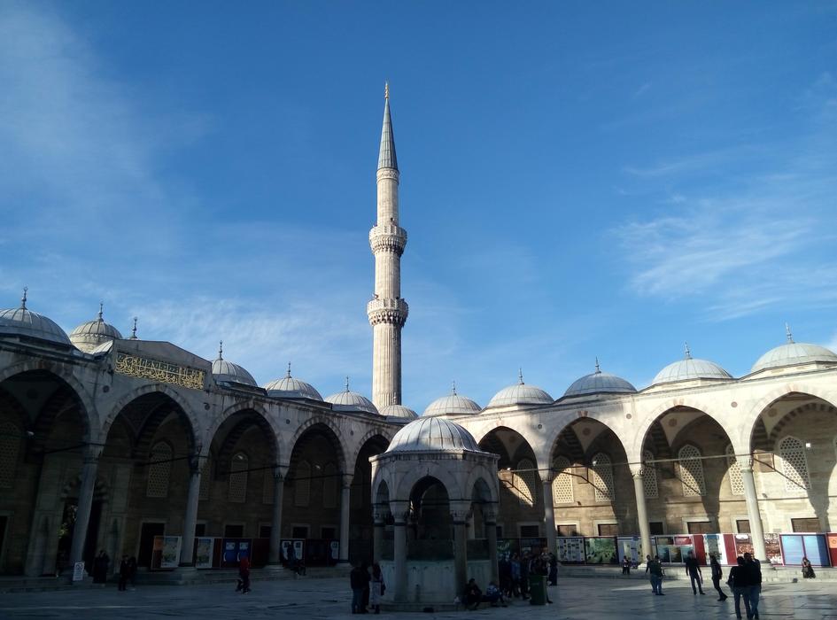 people in the square near the blue mosque in turkey