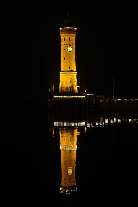 distant view of the lighthouse at Lindau at night