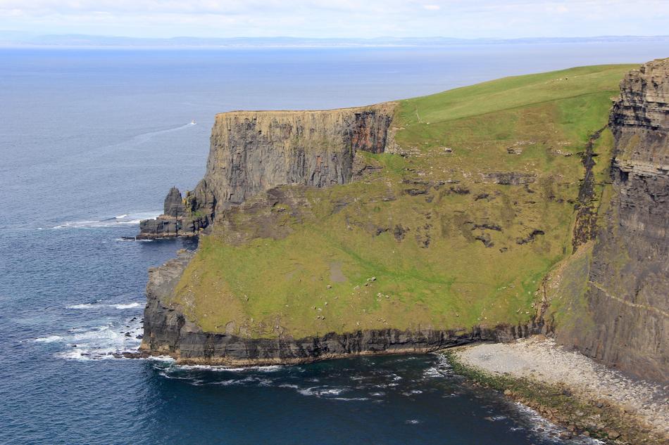 Beautiful and colorful Cliffs of Mother in Ireland, among the blue water