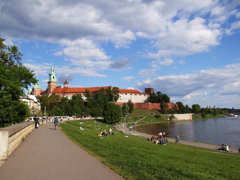 Beautiful landscape of the Wawel Castle, near the water, among the plants in KrakÃ³w, Poland