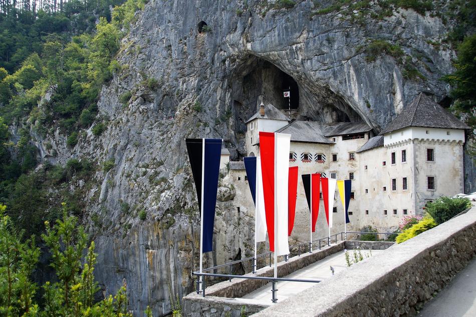 flags on the bridge near the castle