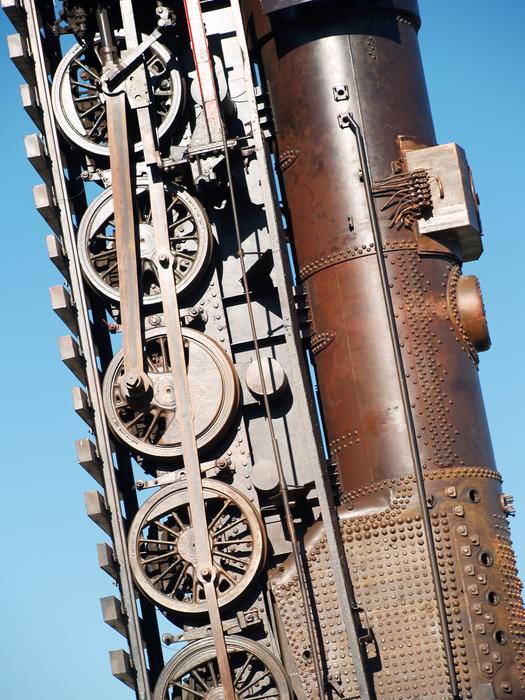 steam Locomotive on railway at sky, detail of sculpture at sky