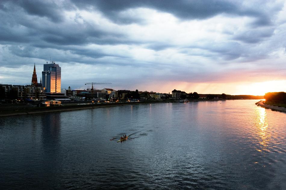 Beautiful landscape of the river among the buildings in Osijek, Croatia, at beautiful and colorful dusk
