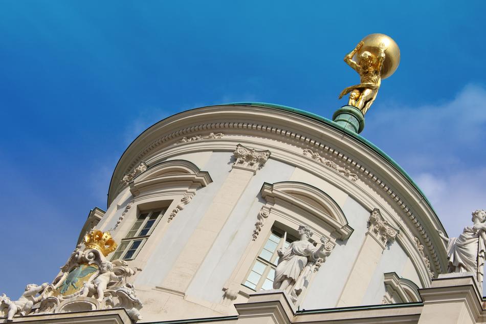 Beautiful town hall with gold figures in sunlight, in Potsdam, Germany