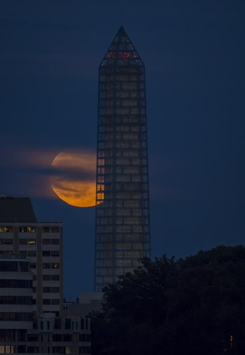 tower on the background of a full month at night in america