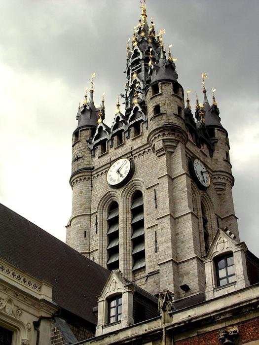 palace with clock tower in Douai