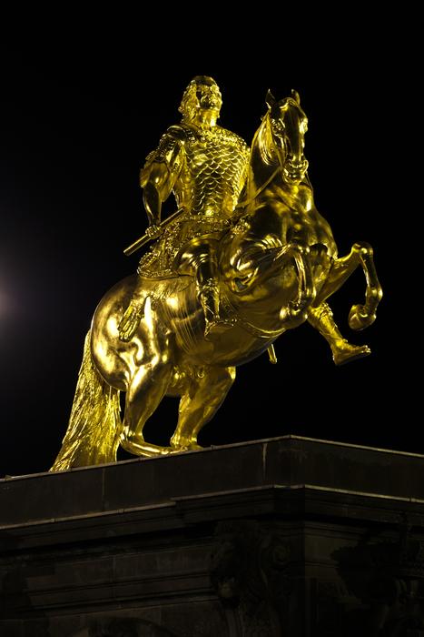 golden monument in the center of dresden at night