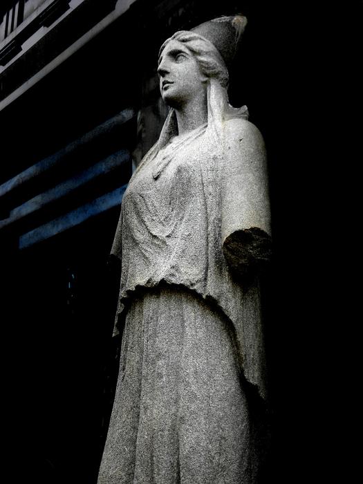 Marble sculpture of the woman in Argentina, in light, at dark background